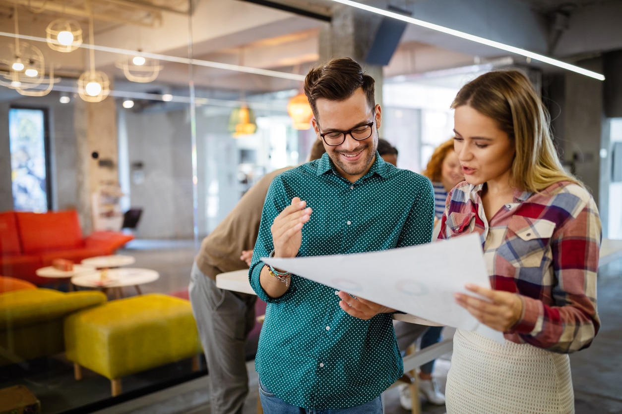 Business people having fun and chatting at workplace office