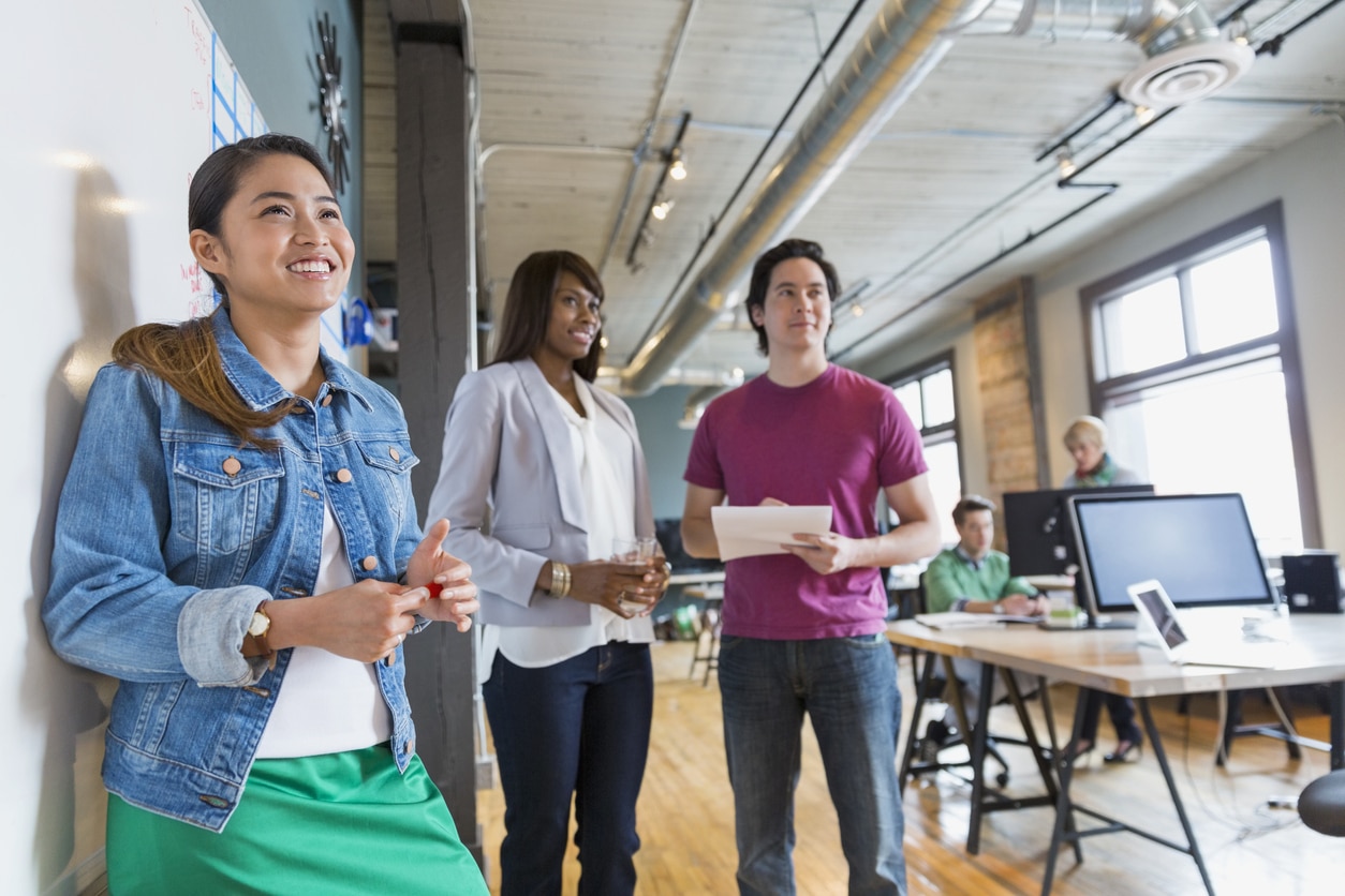 Group of entrepreneurs working in creative office space